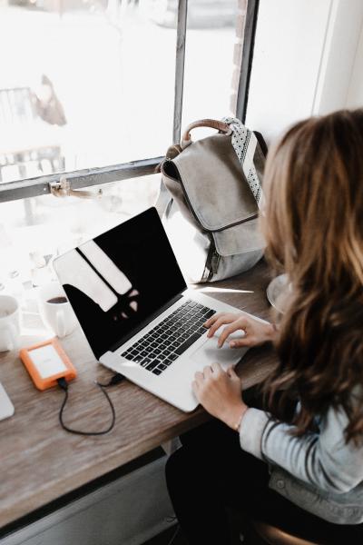 Woman sitting at desk with laptop