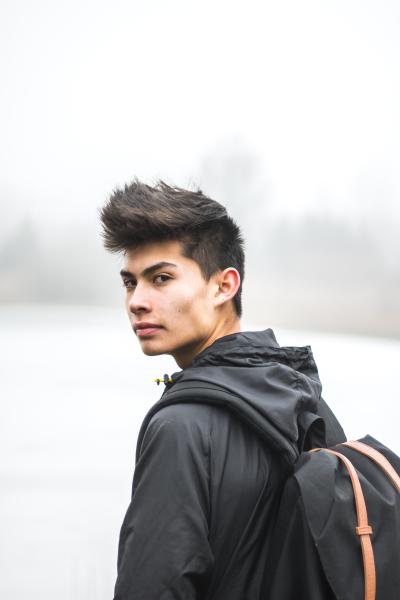Young man wearing backpack