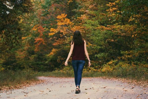 Woman walking in woods
