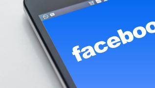 Facebook logo on phone screen