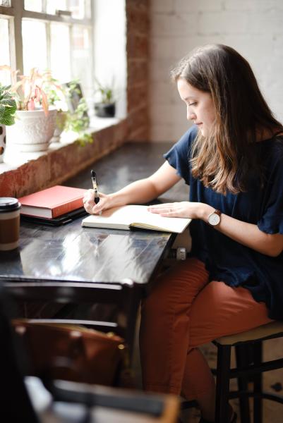 Woman writing at desk