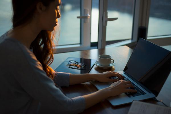 Woman sitting at laptop