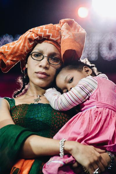 Woman carrying child